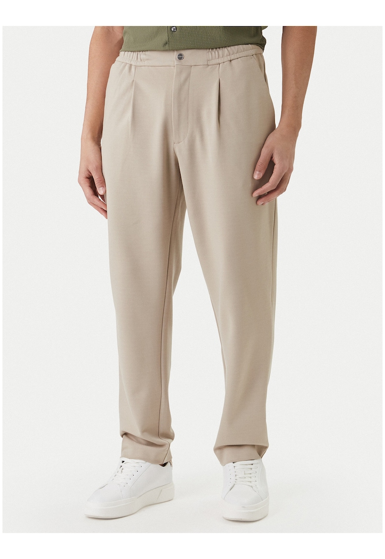 Pantaloni eleganti cu croiala conica si talie medie