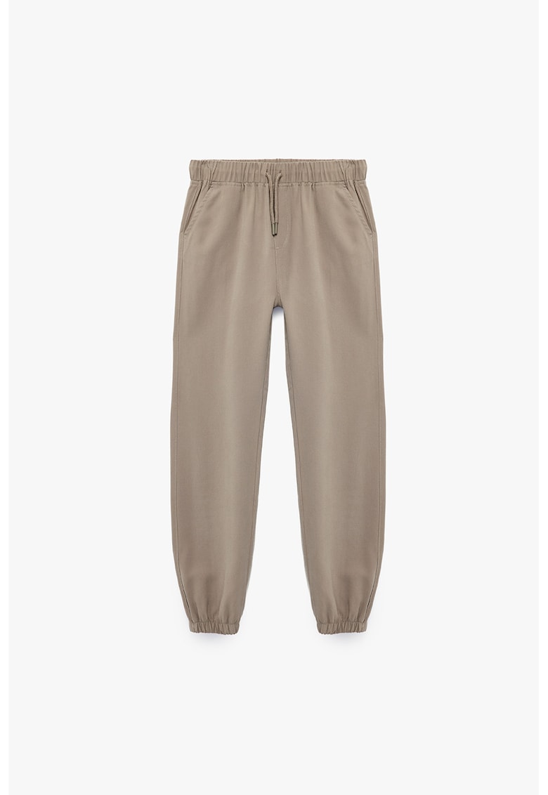 Pantaloni de trening cu croiala conica si terminatii elastice - Bej
