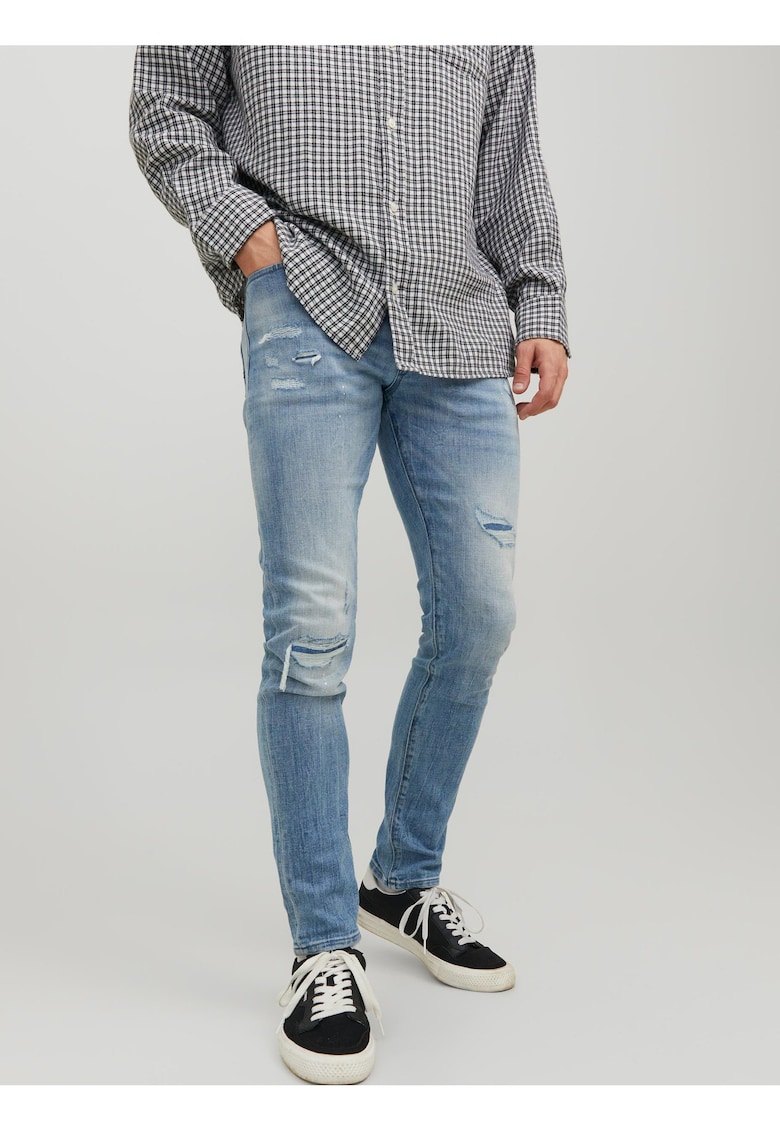 Blugi skinny cu rupturi decorative
