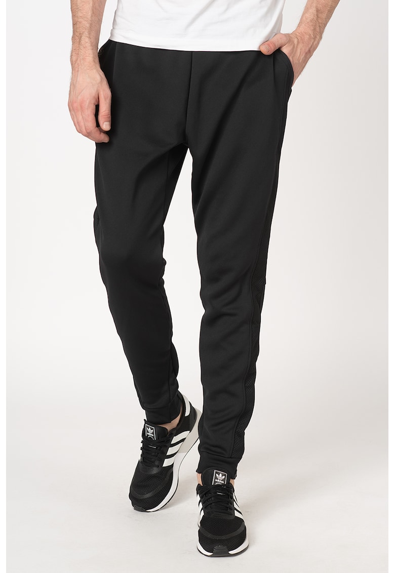Pantaloni sport cu slituri cu fermoar la glezna - pentru tenis