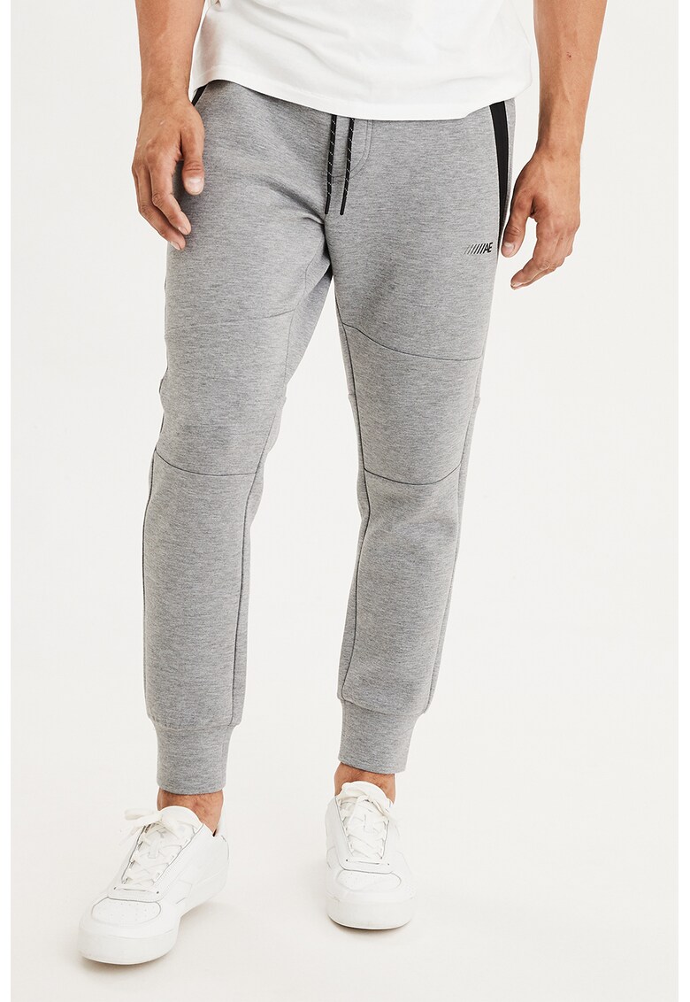Pantaloni sport cu buzunare cu fermoar