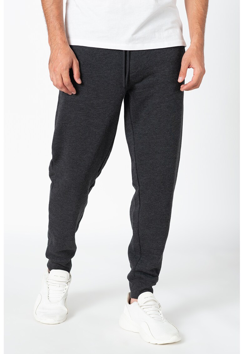 Pantaloni sport conici cu buzunare oblice