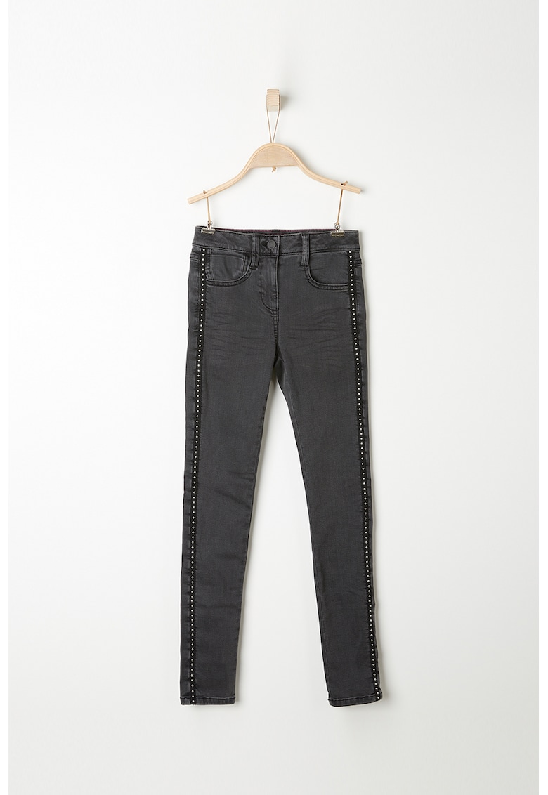 Blugi skinny cu vipusca cu nituri