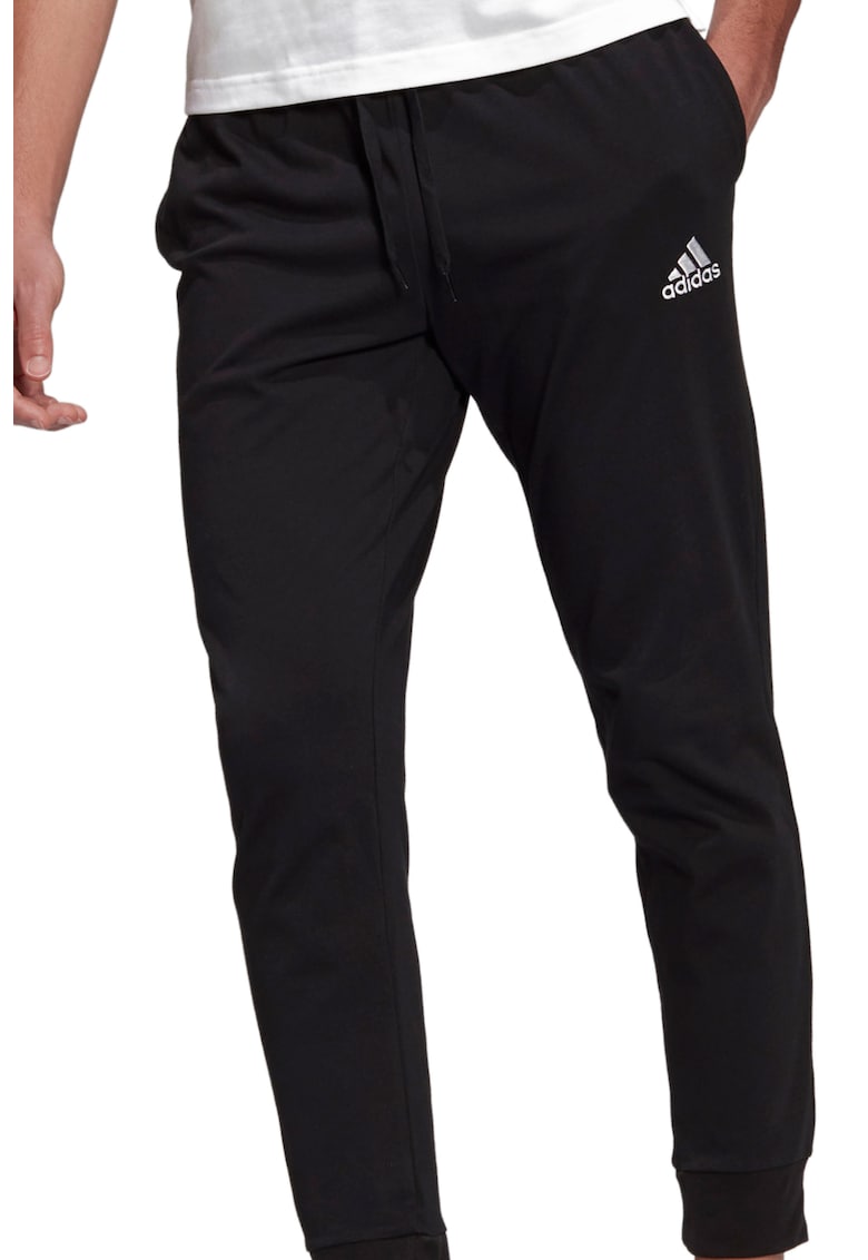 Pantaloni sport cu croiala conica si logo Essentials