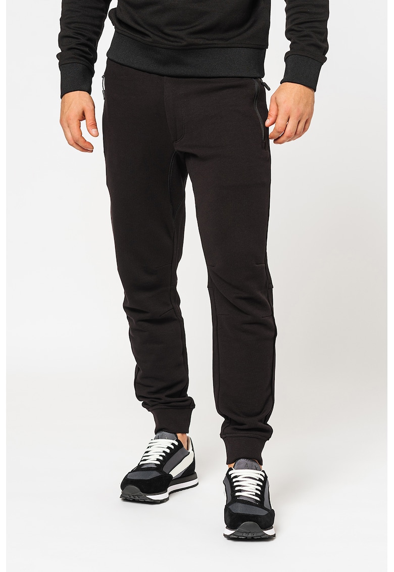 Pantaloni sport conici cu buzunare cu fermoar