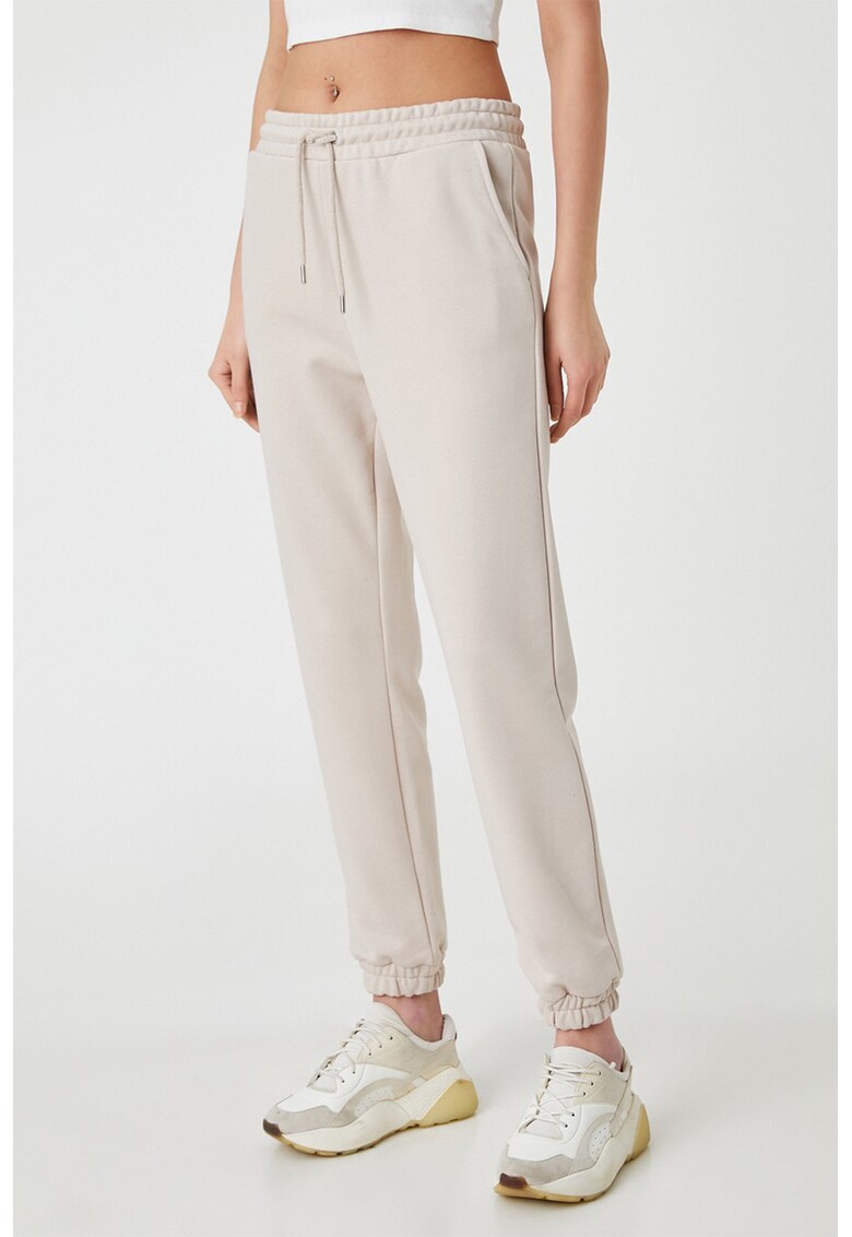 Pantaloni sport cu buzunare oblice