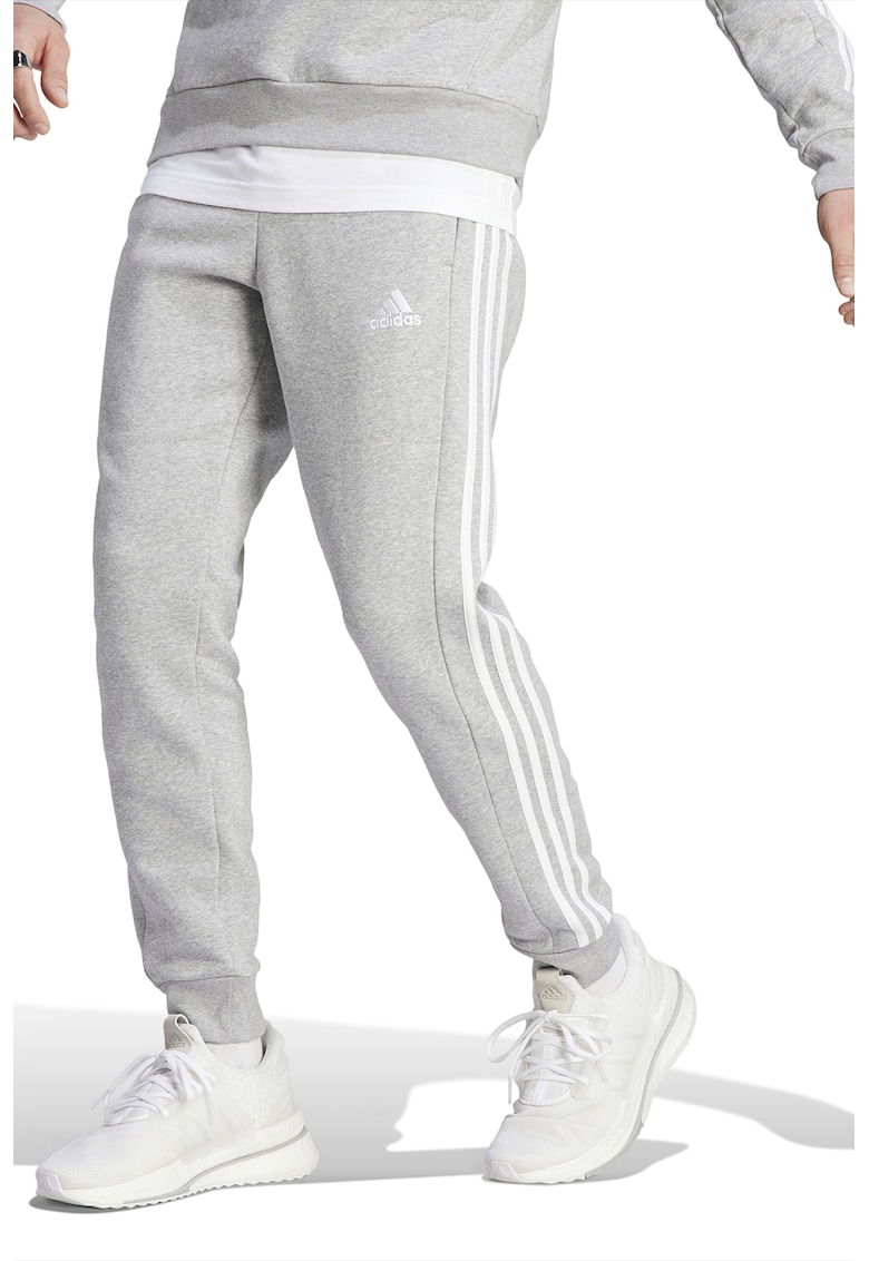 Pantaloni de trening conici cu buzunare laterale