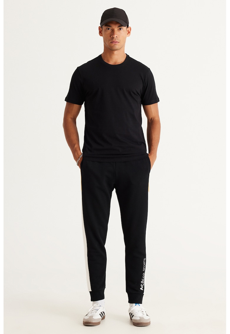 Pantaloni de trening din amestec de bumbac cu croiala conica