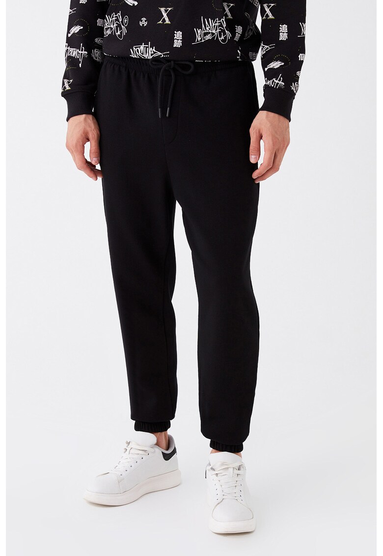 Pantaloni sport cu buzunare oblice
