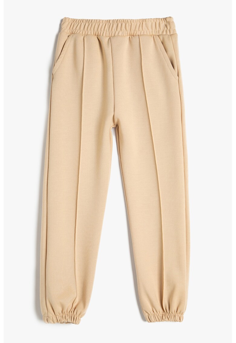 Pantaloni conici de trening cu buzunare oblice