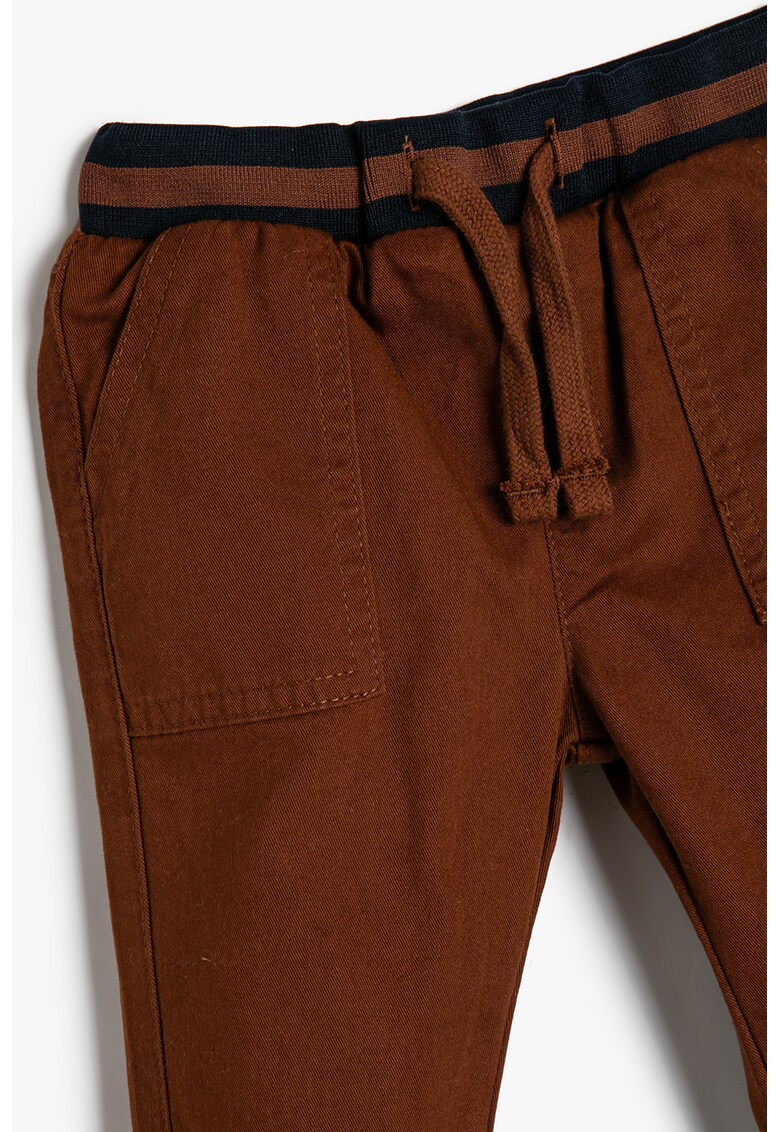 Pantaloni conici cu snur