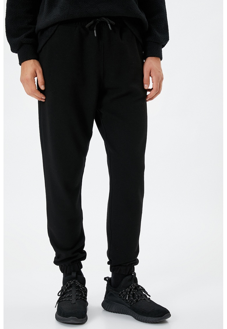 Pantaloni conici de trening cu snur