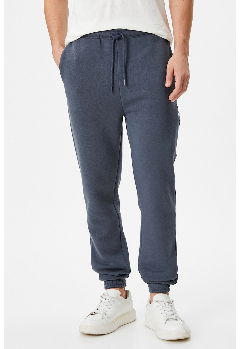Pantaloni de trening cu buzunare cu fermoar