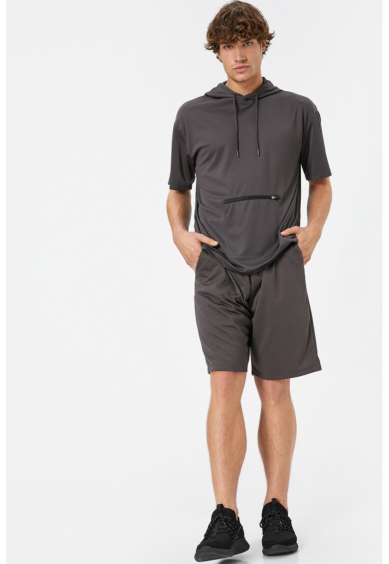 Pantaloni cu model uni si buzunare laterale