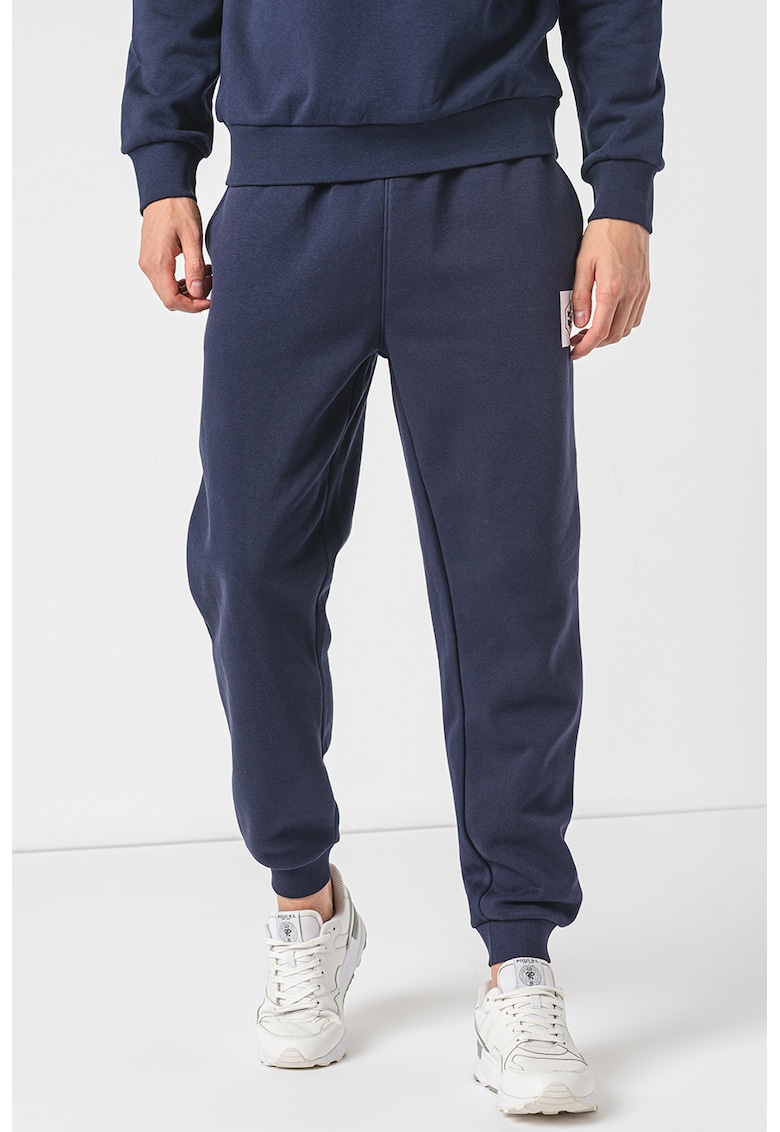 Pantaloni de trening conici cu buzunare oblice