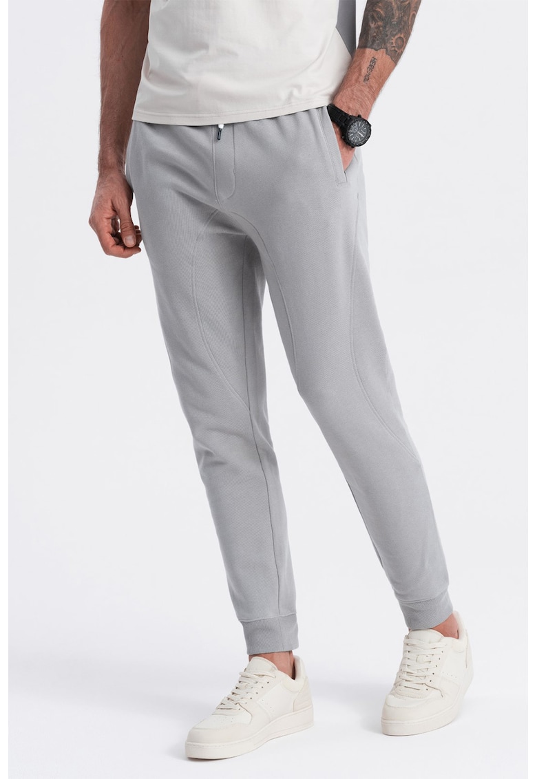 Pantaloni de trening cu croiala conica si snur de ajustare