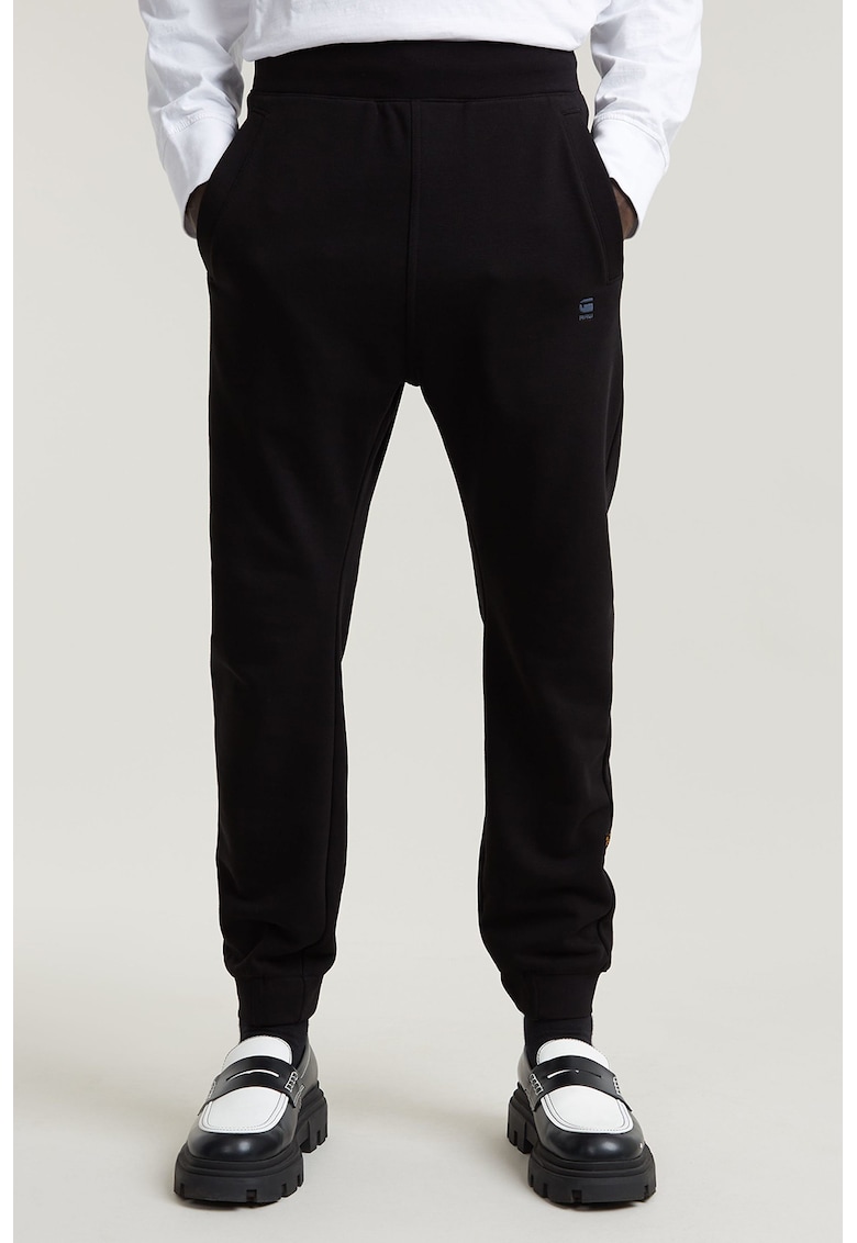 Pantaloni de trening cu croiala conica si buzunare - Negru
