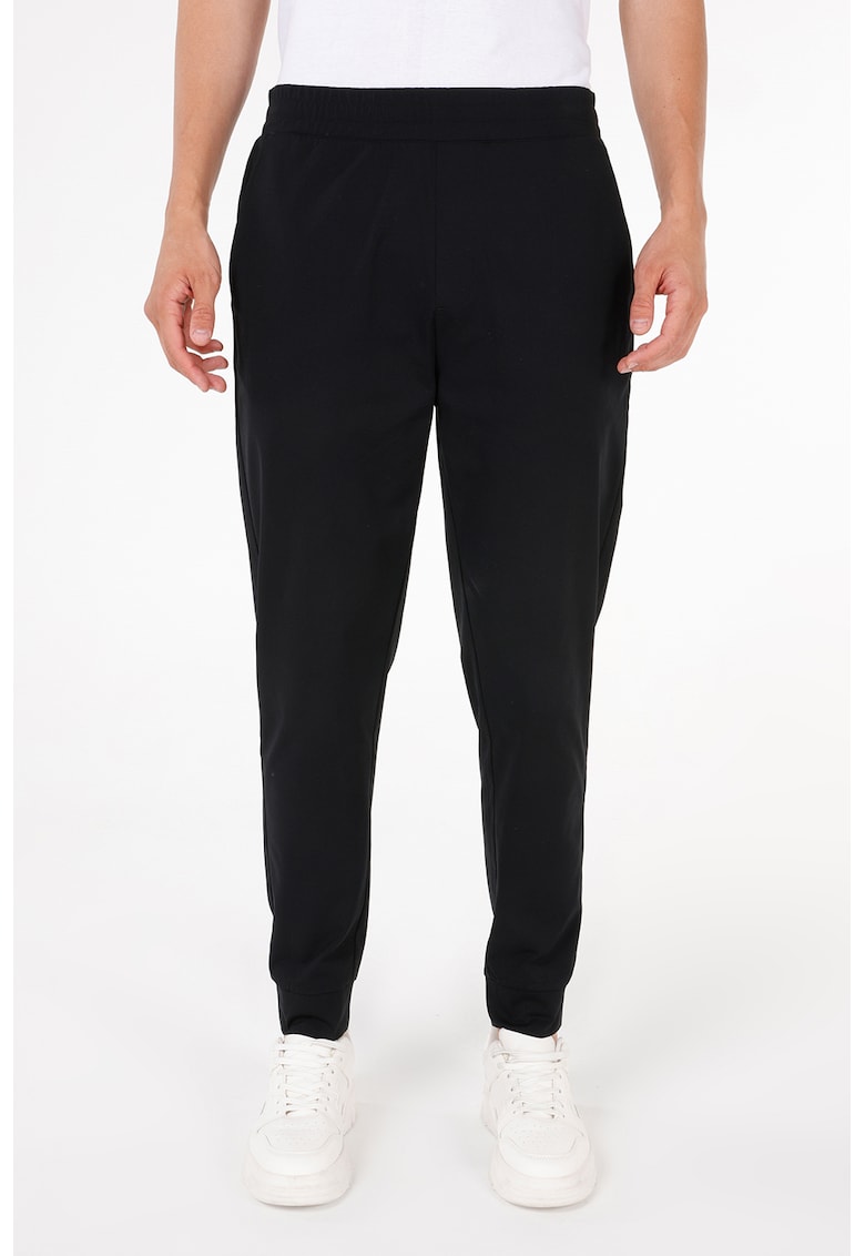 Pantaloni jogger uni cu croiala conica