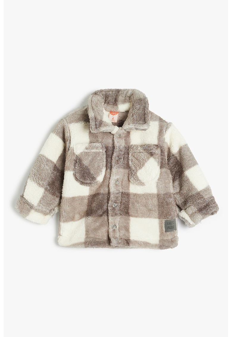 Jacheta pufoasa cu buzunare pe piept