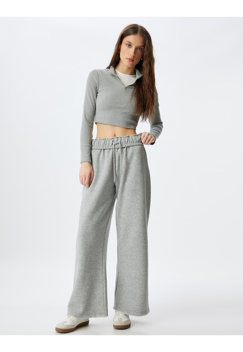 Pantaloni de trening cu croiala conica si snururi