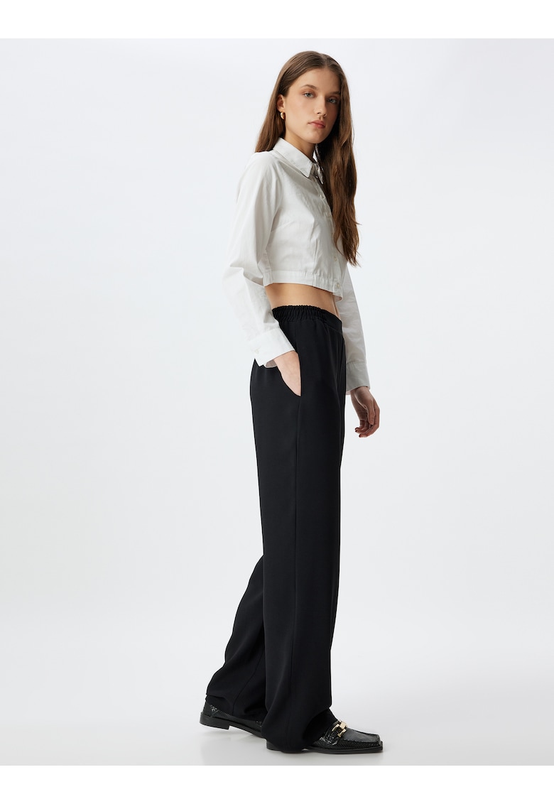 Pantaloni cu croiala ampla si buzunare oblice - Negru