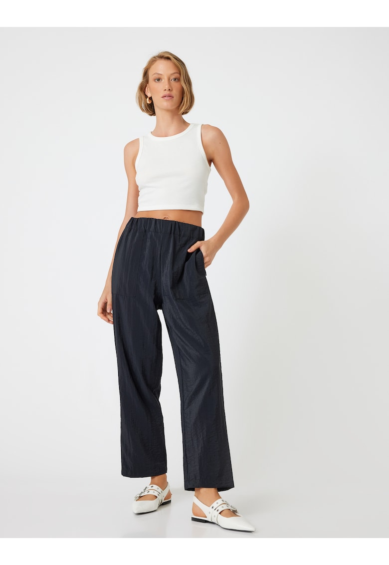 Pantaloni uni cu buzunare oblice