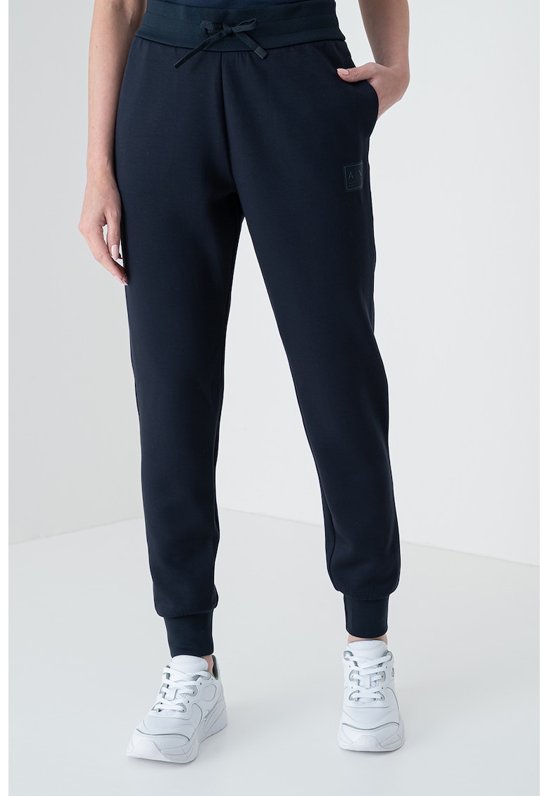 Pantaloni conici de trening