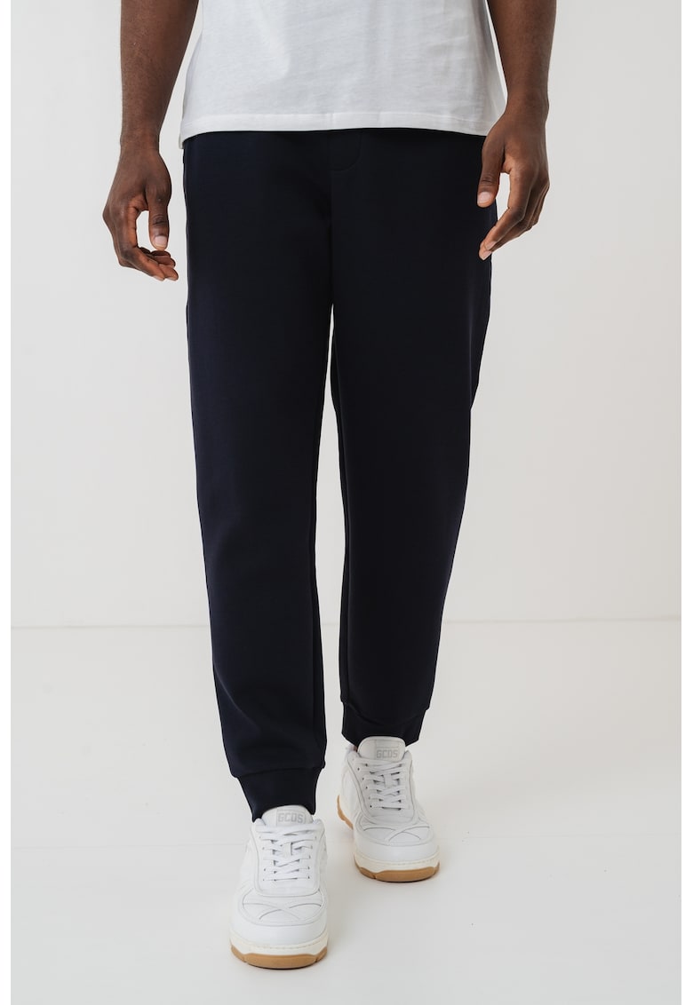 Pantaloni conici de trening