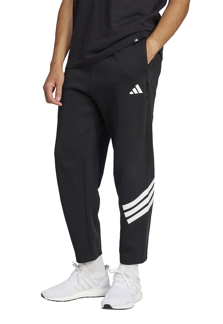 Pantaloni de trening cu croiala conica si logo