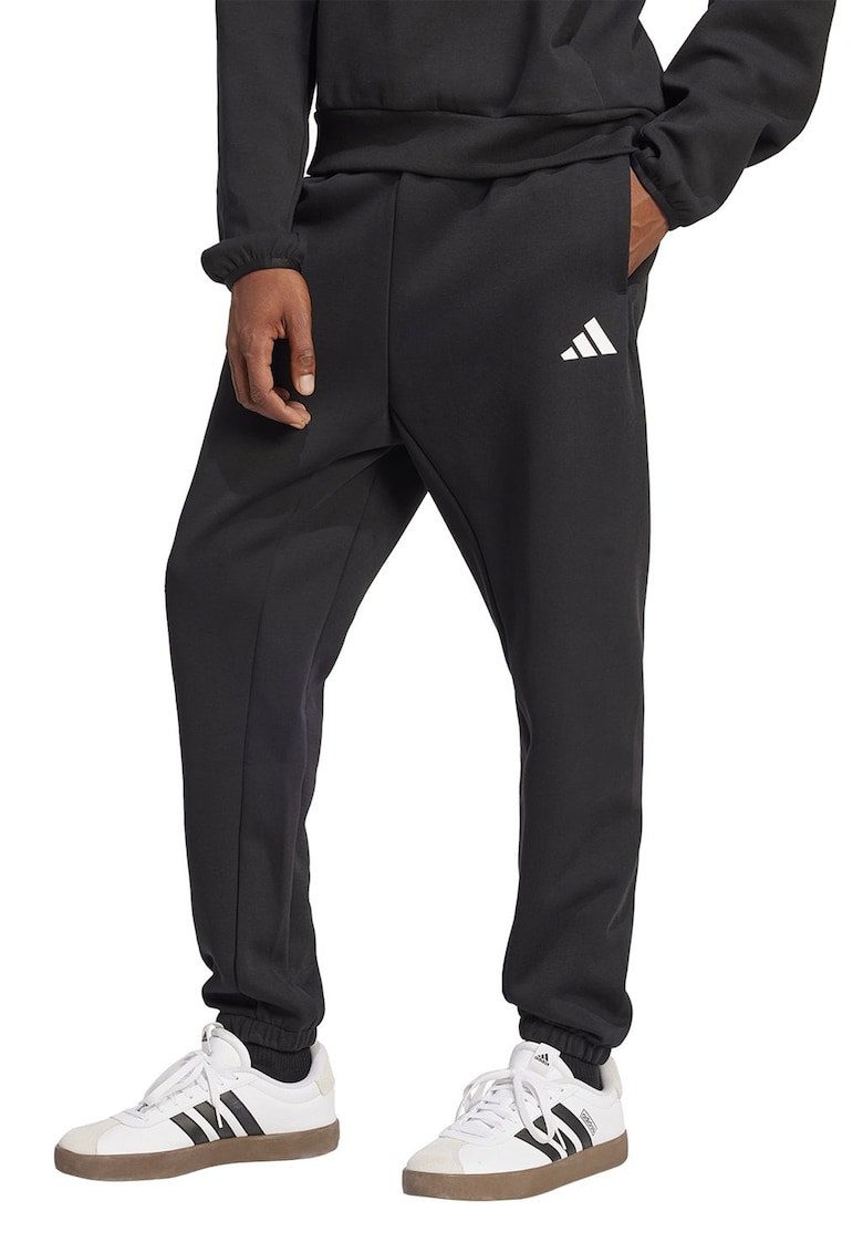 Pantaloni de trening conici cu buzunare laterale