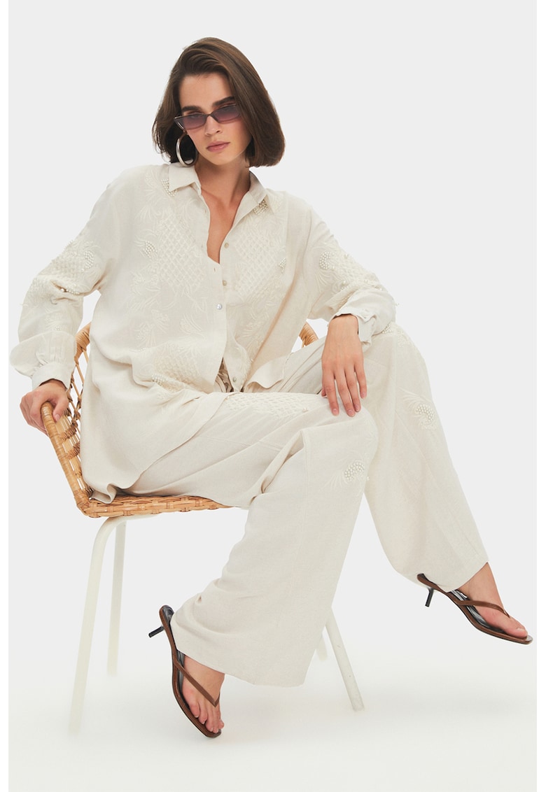 Pantaloni cu croiala ampla si buzunare laterale