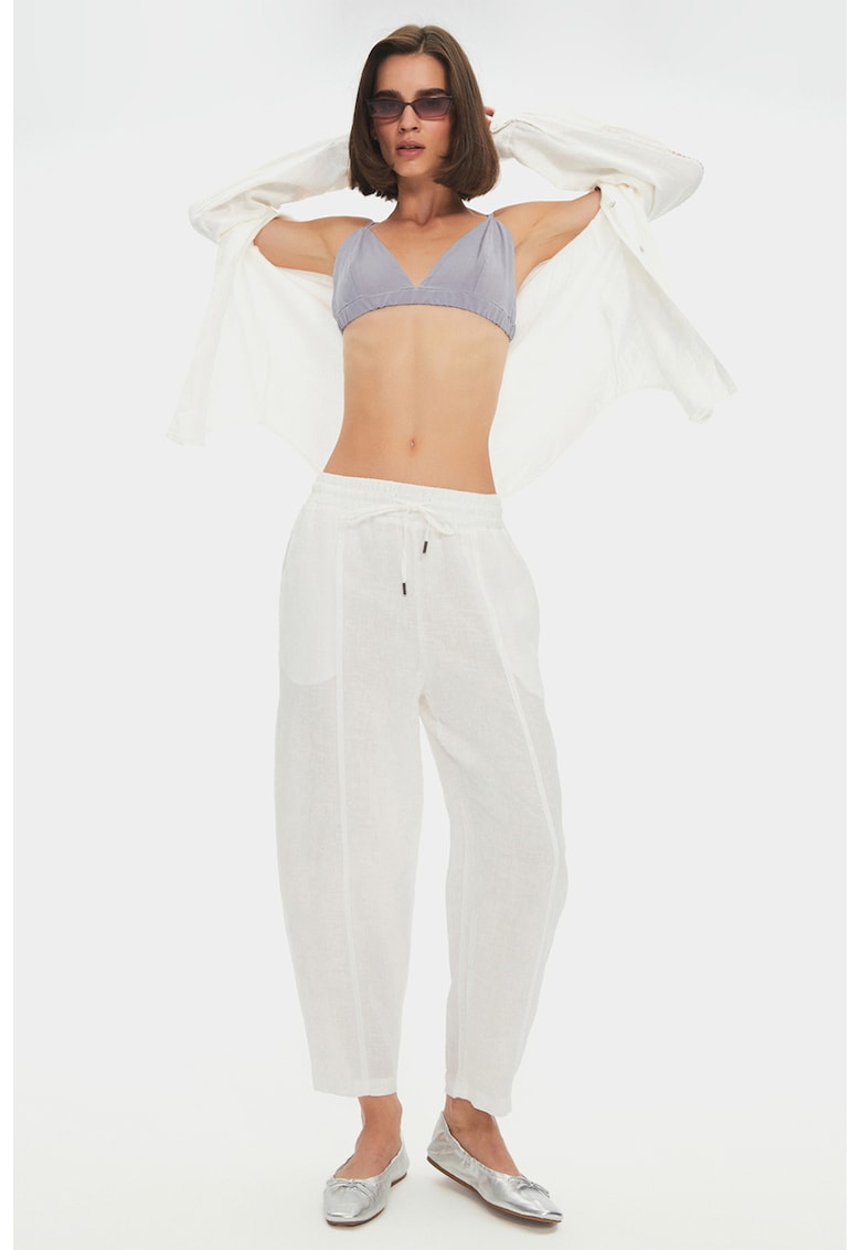 Pantaloni conici cu model uni