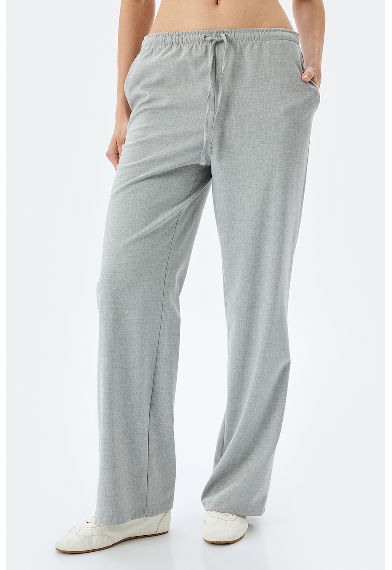 Pantaloni cu croiala ampla si talie elastica