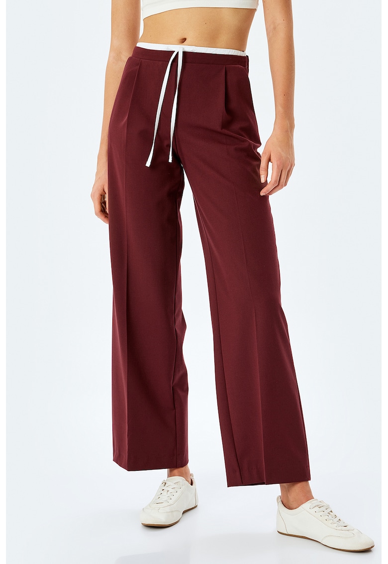 Pantaloni cu croiala ampla si talie inalta