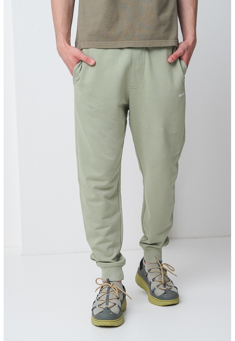 Pantaloni de trening cu croiala conica si snur