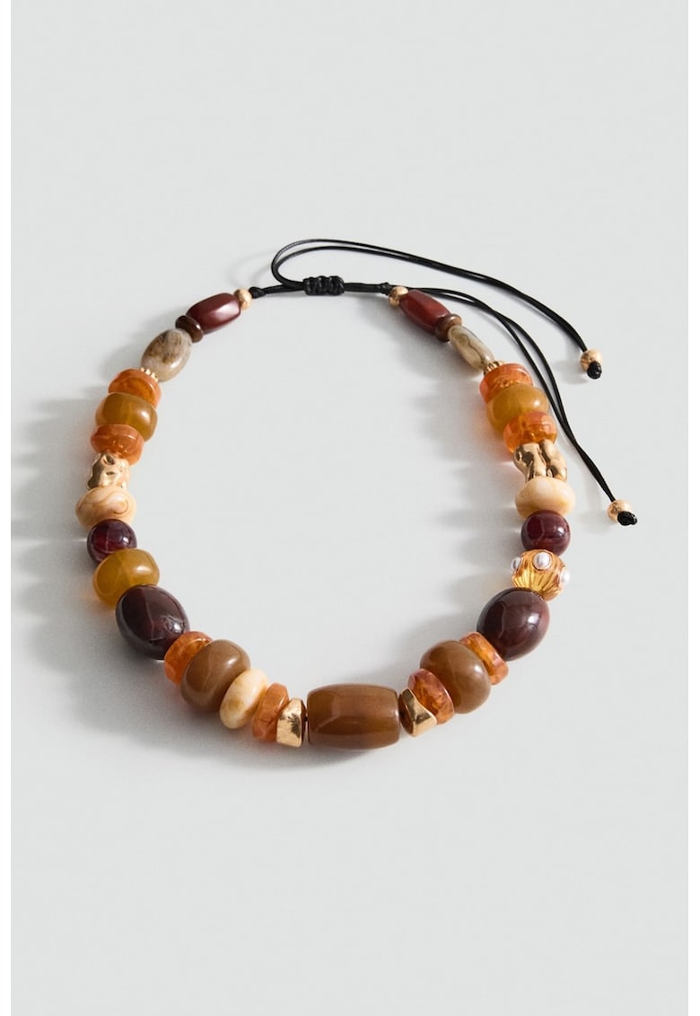 Colier cu margele de diferite dimensiuni