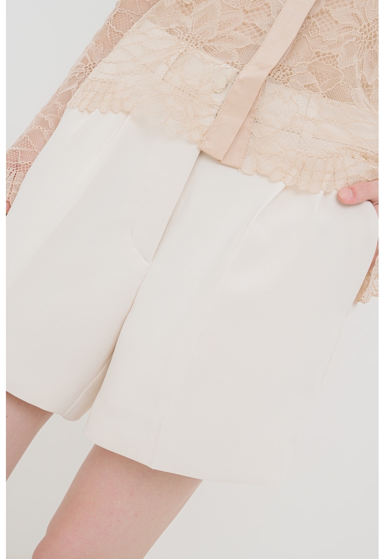 Pantaloni scurti cu buzunare oblice