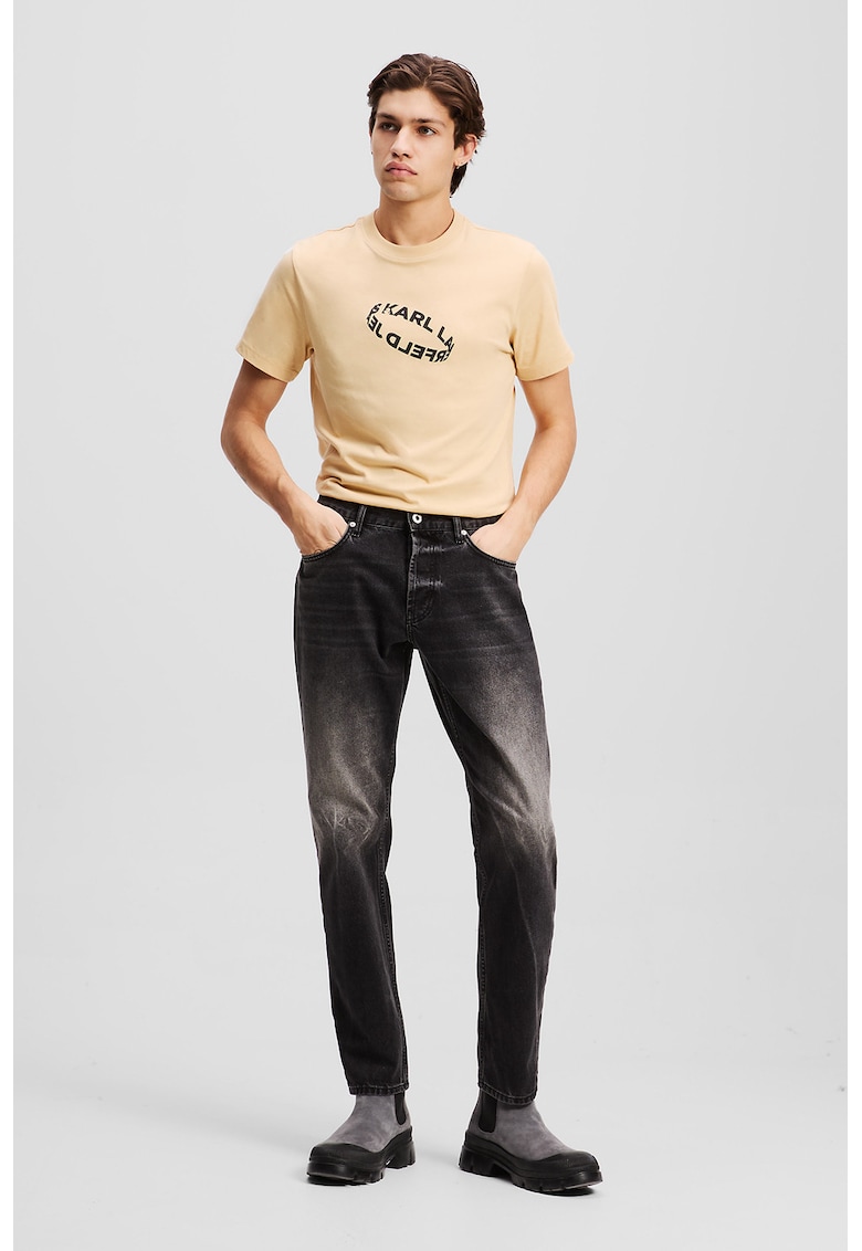 Blugi conici din amestec de bumbac organic cu aspect decolorat