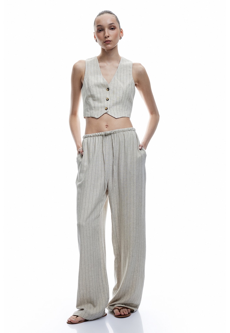 Pantaloni cu buzunare laterale si model in dungi