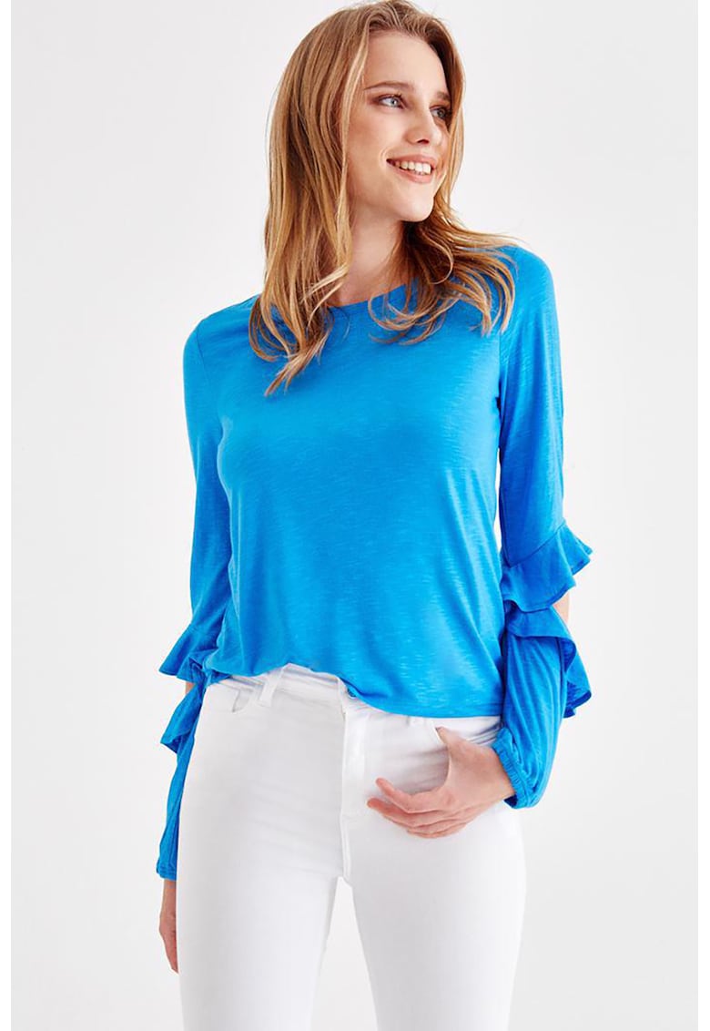 Bluza cu decupaje la nivelul coatelor