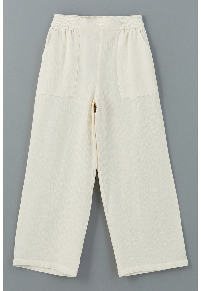 Pantaloni cu croiala ampla si buzunare oblice