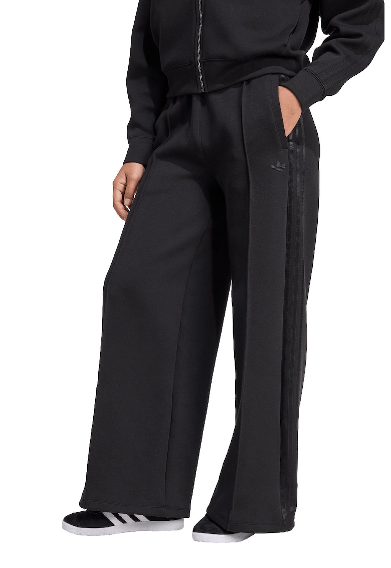 Pantaloni de trening cu croiala ampla si dungi laterale