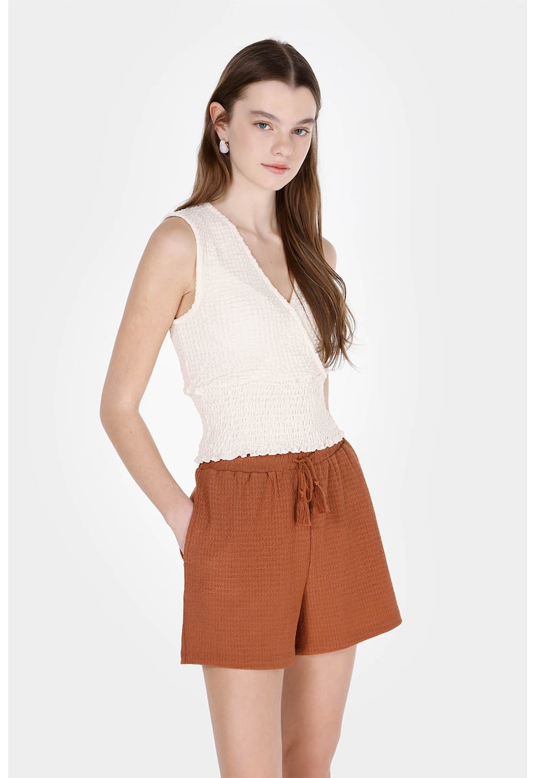 Top cu terminatii elastice