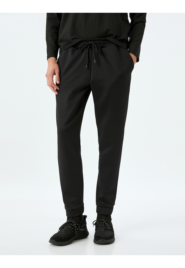 Pantaloni slim fit de trening cu snur