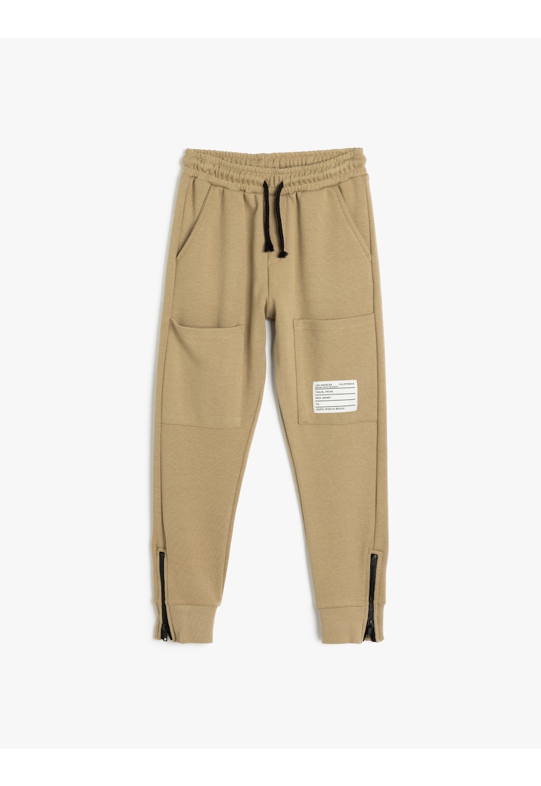 Pantaloni de trening cu snur de ajustare si slituri cu fermoar