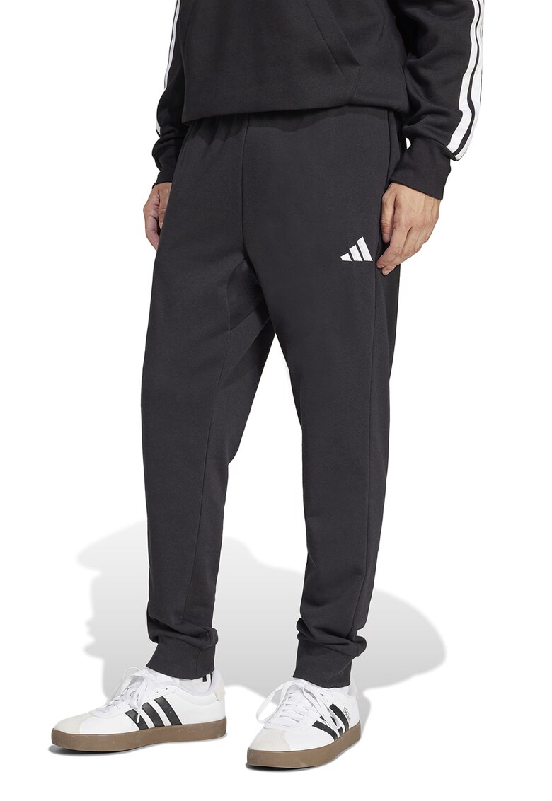 Pantaloni de trening conici cu buzunare laterale